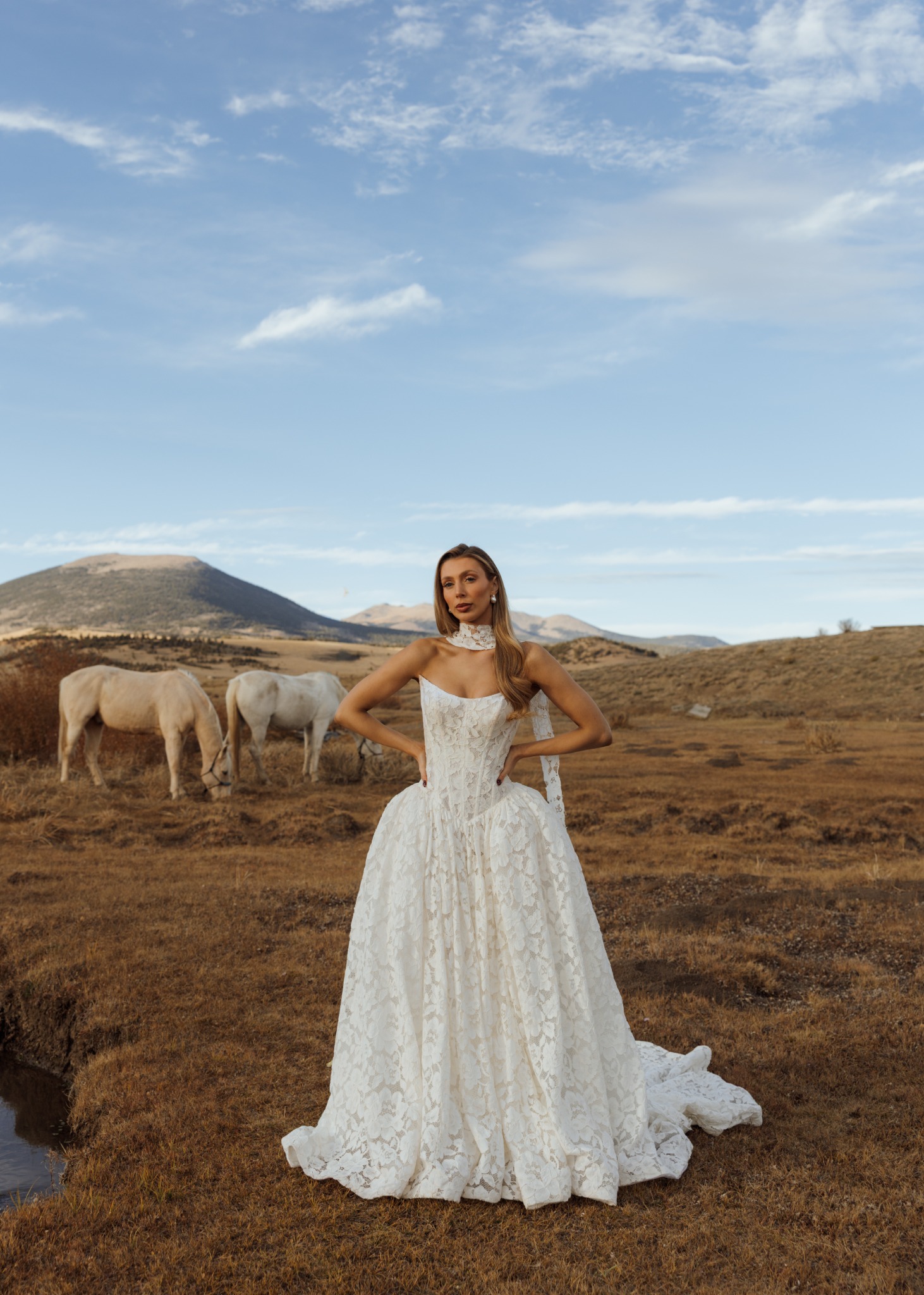 Bride in a western landscape with horses